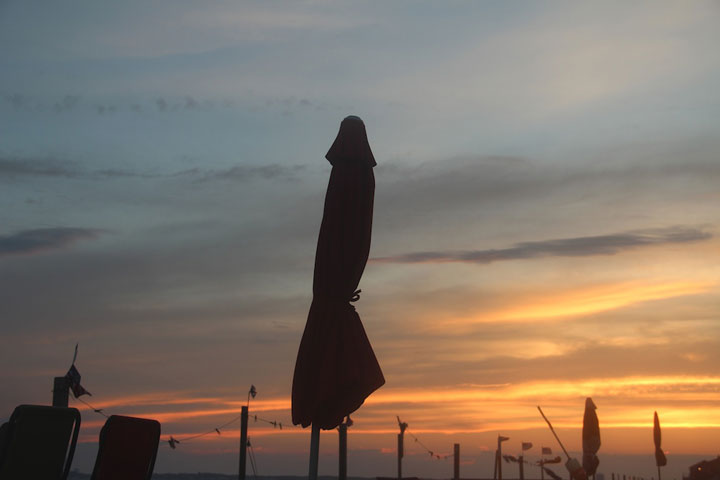 North Truro... folded beach umbrella, photograph by Ewa Nogiec